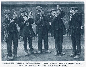 Strikers Collection: Lancashire miners extinguishing their lamps after ceasing work