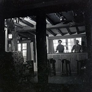 Panelled Gallery: Landlord and landlady in a pub