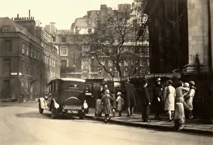 Automobilia Prints: Large car pulled up outside a church