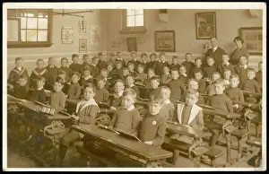 Large classroom of boys with two teachers