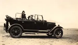 Large saloon car on the beach