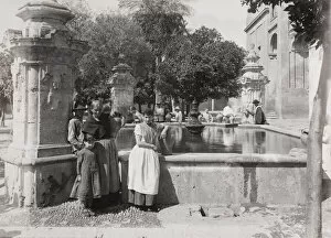 Cordoba Collection: Late 19th century photograph: People with water jars, Public well, fountain, Cordoba