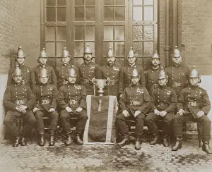 Competitions Prints: LCC-LFB firemen, winners of a trophy, Olympia 1912