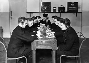 Headphones Prints: LCC-London Fire Brigade training in use of telephone