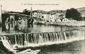 River Bank Prints: Le Vigan, France - Riverbank and the Old Bridge