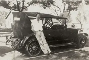 Leaning against his motor