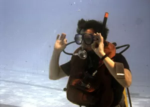 Learning to scuba dive in a swimming pool