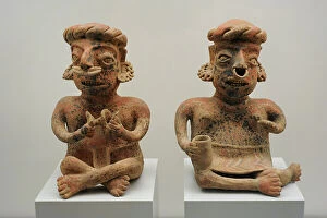 Mesoamerican Collection: Left to right: seated male figure and seated female figure