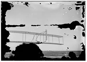 Life Saving Prints: Left view of Wilbur gliding, Kitty Hawk Lifesaving Station a