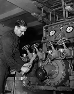 Enclosed Prints: LFB firefighter cleaning an enclosed pump vehicle