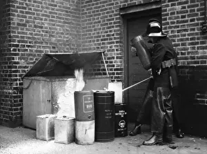 Extinguish Prints: LFB firefighters extinguishing oil can fire