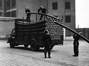 Piping Prints: LFB firefighters unloading piping from a vehicle