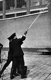 Squirt Prints: LFB firefighters using a hand squirt