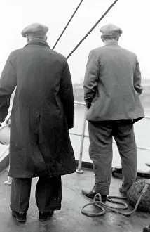 Raincoat Prints: Life on a North Sea trawler - two men on deck in raincoat