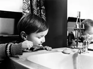 Little boy brushing his teeth
