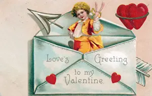 Little boy with hearts in an envelope on a Valentine card