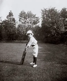 Batting Prints: Little boy practising cricket in garden, Ealing, West London