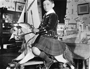 Tartan Collection: Little boy on rocking horse