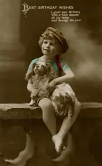 Little boy with spaniel on a birthday postcard