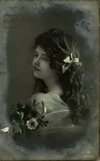 Images Dated 19th December 2011: Little girl with dark hair and flowers