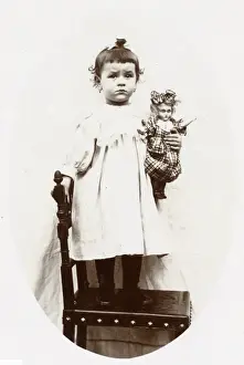 Frowning Prints: Little girl with doll, Normandy, France