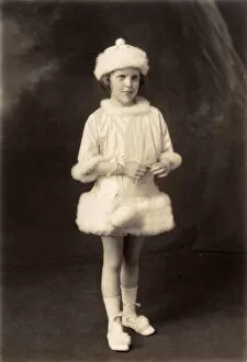 Little girl in fancy dress as a powder puff