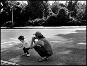 Little girl and her father waiting for bus Italy