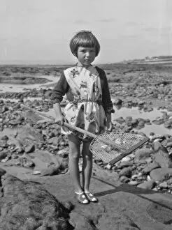 Nets Gallery: Little girl with fishing net at the seaside