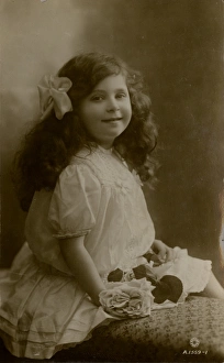 Images Dated 9th January 2012: Little girl in frilly white dress with roses 1915