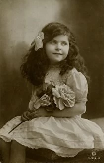 Images Dated 9th January 2012: Little girl in frilly white dress with roses 1915
