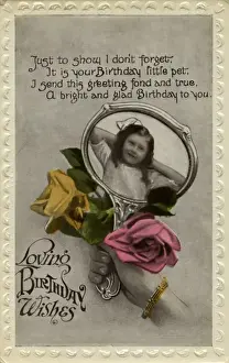 Little girl in hand mirror, with roses