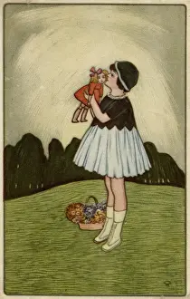 Little girl on a hillside with her doll