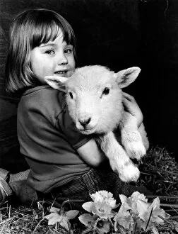 Spring Gallery: Little girl holding a lamb