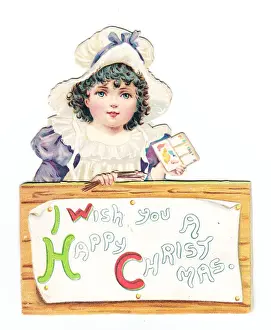 Little girl with paintbox on a cutout Christmas card