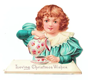 Images Dated 5th July 2018: Little girl at a table on a cutout Christmas card