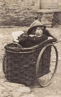 Perambulator Prints: Little girl in a wicker pram