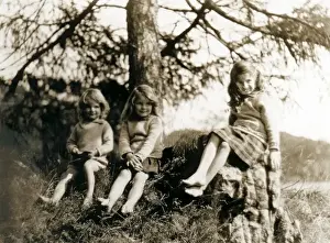 Outcrop Prints: Three little girls sitting on a wooded outcrop, Scotland