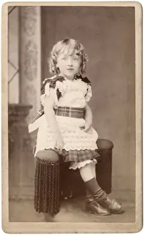 Trimmings Prints: Little Victorian girl in lacy dress with tartan trimmings