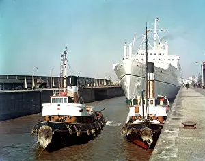Tugs Prints: Liverpool - RMS Empress of England entering dock with tugs