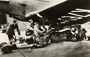 Arming Collection: Loading Bombs onto an RAF Bomber prior to a patrol flight