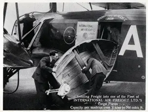 Lifting Prints: Loading freight into one of the Fleet of International Air Freight Ltd