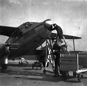 Loading mail bags into de Havilland DH86 Express Air Liner