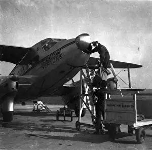 Loading mail bags into de Havilland DH86 Express Air Liner