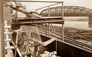 Loading pig iron into railroad cars at steelworks