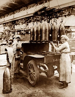 Munitions Collection: Loading shells onto a lorry in a munitions factory - WW1