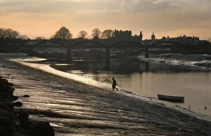 Muddy Gallery: Lobster fisherman leaves boat and climbs bank of River Dee