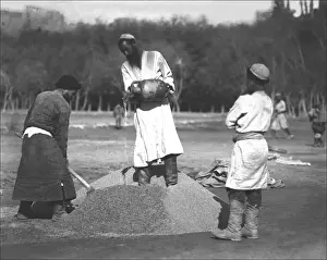 Xinjiang Prints: Local men mixing cement in Kashgar, western China