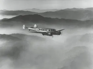 Electra Prints: Lockheed L-10 Electra above misty hills