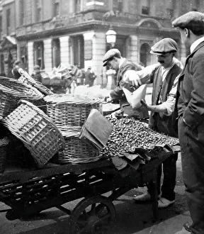 London barrow boy selling cherries, early 1900s