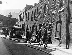 Hosepipe Prints: London firefighters at work in Dingley Road, WW2
